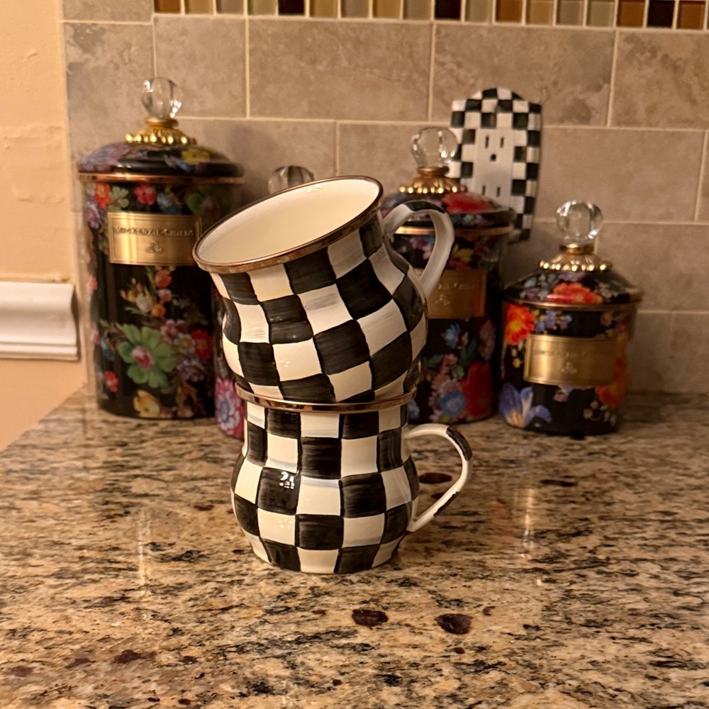 A pair of MacKenzie Childs Courtly Check Coffee Cups
